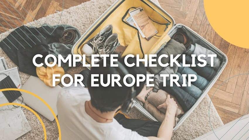 Overhead view of a person packing a suitcase with essential items for a Europe trip, including clothes, shoes, and travel documents. The text 'COMPLETE CHECKLIST FOR EUROPE TRIP' overlays the image